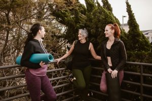 women in exercise gear talking about supplements for menopause